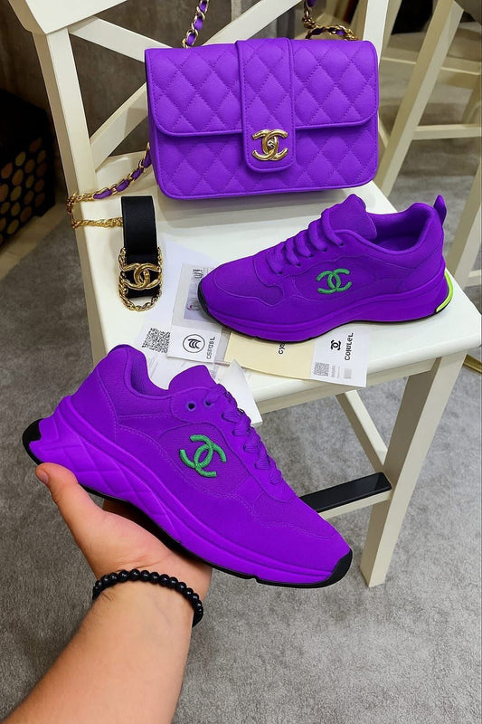 **🔥 The Amazing Purple Neoprene CC Low Top Sneakers" + Luxe Purple Shoulder Bag Reign Supreme in Style 🔥**